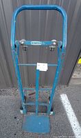 Full view of blue Craftsman hand truck standing upright