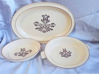 Three Pfaltzgraff Village pieces; platter and two bowls