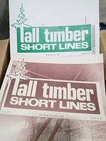 Close-up of two Tall Timber Short Lines front covers, July 1988 and December 1988