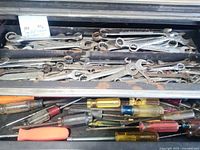 Drawer filled with wrenches and screwdrivers