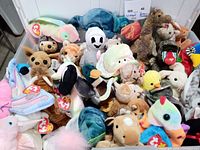 Top view of full bin showing many Ty Beanie Babies with tags