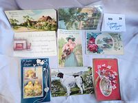 Fronts of all eight postcards laid out