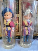 Front view of both Swiss Guard dolls in tubes