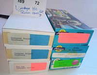 Stacked boxes showing labels for covered hoppers, box car and two Athearn kits