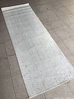 Full view of off-white wool runner laid flat