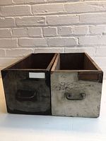 Front view of both wooden drawers showing handles and label holders