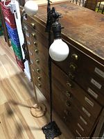 Full view of both floor lamps standing side by side