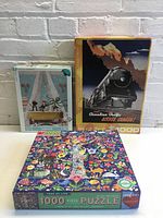 Three puzzle boxes front view