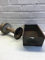 Siren next to metal bin showing overall lot