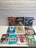 Group shot of 10 books and magazines on table