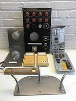 Overview of all components laid out on table against brick wall