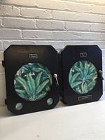 Pair of black metal wall-mount cabinets front view