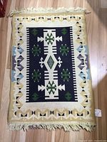 Full view of rug showing pattern, size and fringe