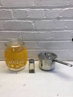 Cookie jar, saucepan and shaker grouped together