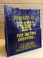 Front three-quarter view of bag showing color, shape and text