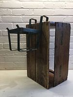 Planter holder attached to wooden crate showing relative size and stencilling