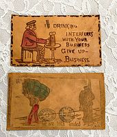 Fronts of both leather postcards showing cartoons and captions