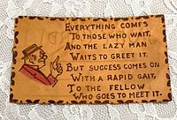 Front of leather postcard showing proverb text and illustration