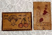 Fronts of both leather postcards showing illustrations and captions