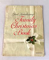 Front cover showing title, ribbon and holly graphic