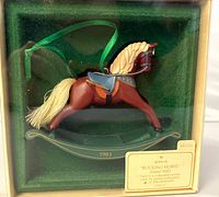 Ornament in original window box showing horse and year mark