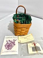 Basket with liner, protector, papers, bag displayed