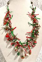 Full view of charm necklace on display bust