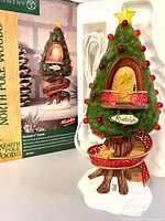 Front view of Rudolph's Condo with box and cord