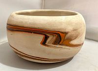 Side view showing swirl design and shape