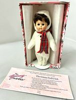 Doll in original box with paperwork visible