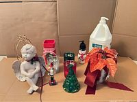 Group shot showing all nine holiday décor items on cardboard background