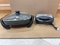 Skillet with lid and sandwich press side by side