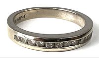 Top view of white gold band displaying channel-set diamonds