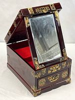 Jewelry box open, showing mirror and interior lining