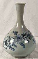 Full view of porcelain vase showing shape and decoration