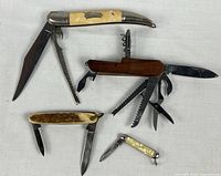 All four folding pocket tools displayed opened
