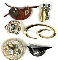Overview of six brooches