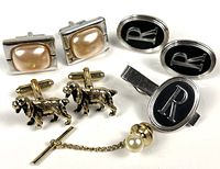 Group view of all cufflinks, tie clip, tie tack
