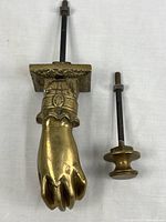 Knocker and strike plate side by side