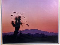Close-up of photograph showing silhouetted yucca at sunset