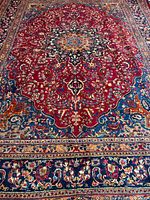 Full view of red field and blue border showing medallion