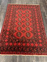 Full view of handmade Turkman wool rug on floor