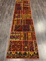 Full view of patchwork Persian runner rug on floor