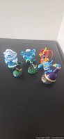 Group shot of five of the Skylanders figurines on black surface