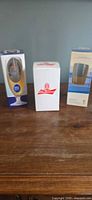 Three boxed glasses on table