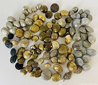 Spiral view of entire assortment showing gold, silver and black buttons plus pin