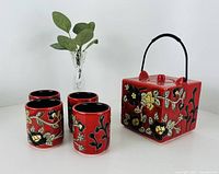red floral ceramic teapot, four matching cups, clear etched glass bud vase