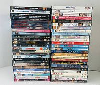 Front view showing three stacks of DVD cases displaying titles and quantity