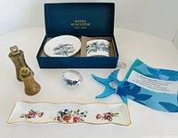 Group view of all seven items including Royal Worcester Westminster bowl and plate in box, trinket dish, blue starfish sun catcher, crystal sun catcher, two brass bells