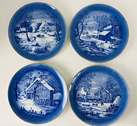 Group shot of four Currier & Ives blue-white plates
